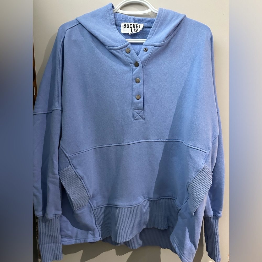 Gorgeous blue sweater with front pocket.